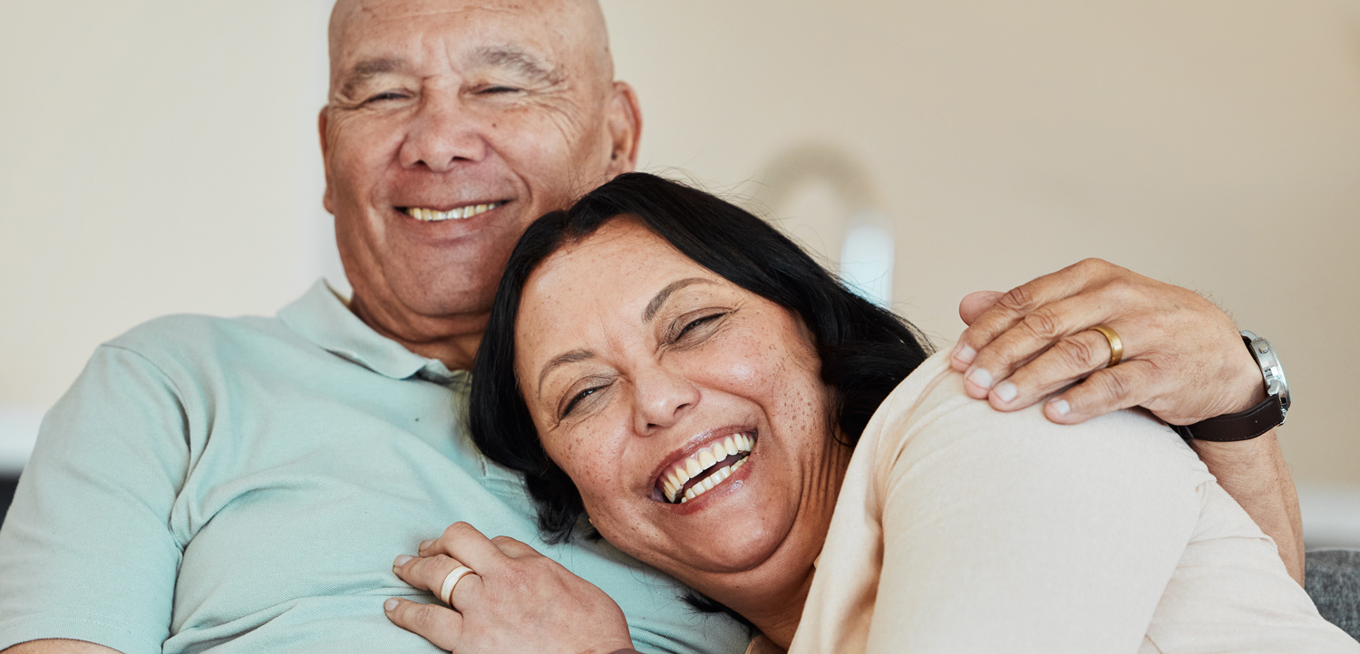 Man and woman smiling after oral surgery in Seminole FL