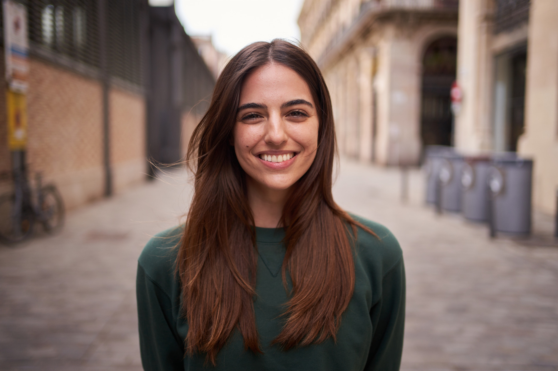 woman smiling after dental implants at Dr. Jenna D Godwin Oral and Maxillofacial Surgery