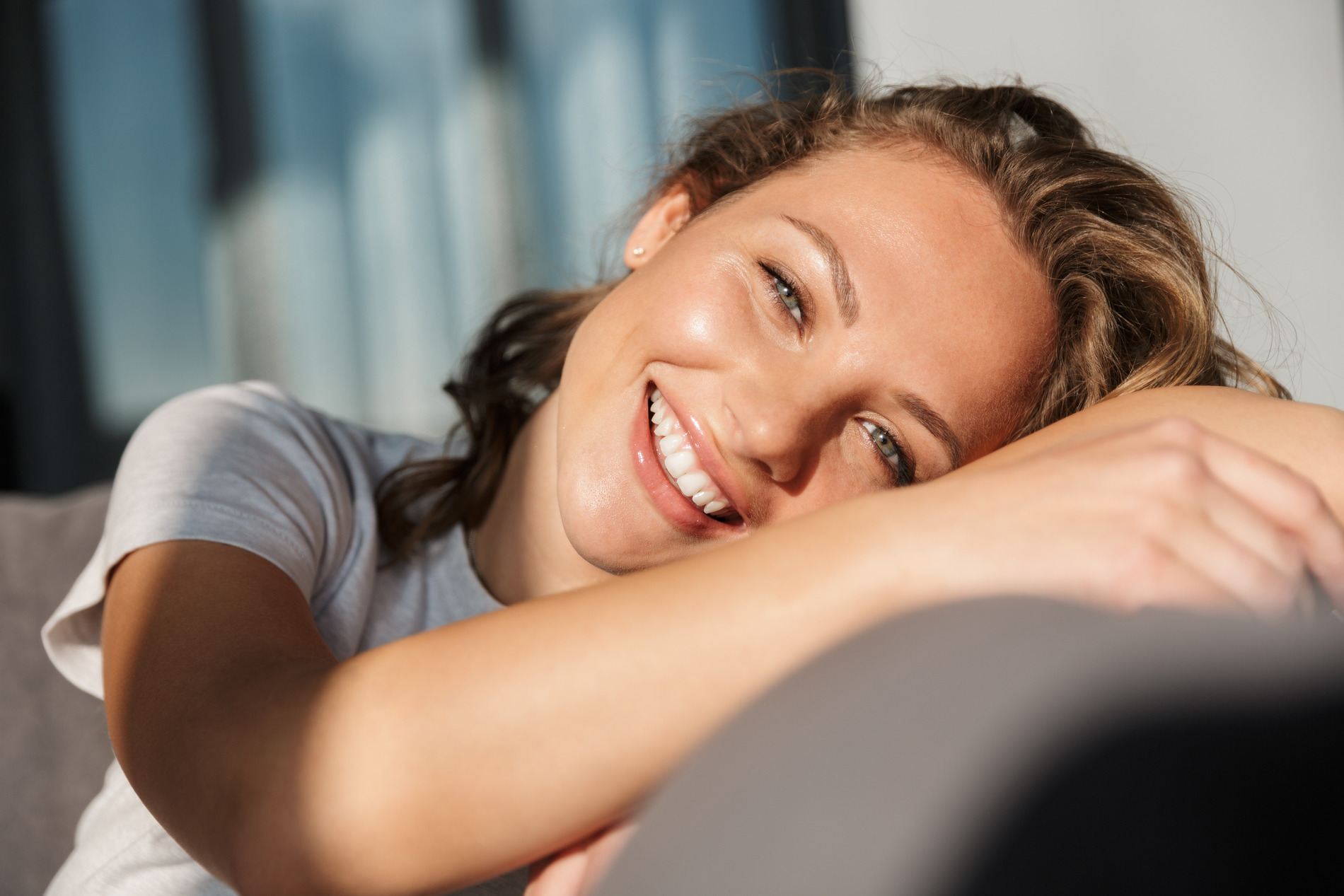 AdobeStock_330736060 v2 Woman smiling after Impacted Canine treatment in Seminole FL
