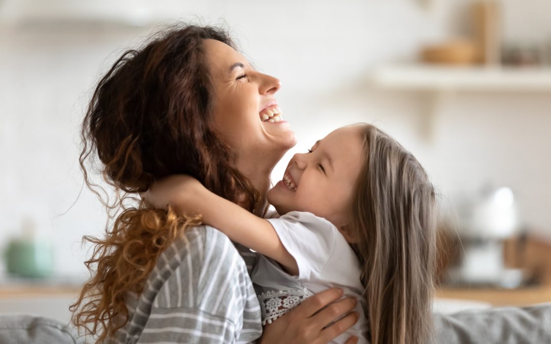 Mother playing with her child after an oral surgery procedure in Seminole