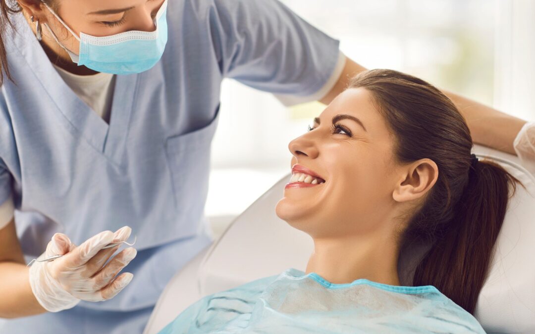 Woman at her oral surgery appointment learning about recovery with Dr. Godwin in Seminole FL